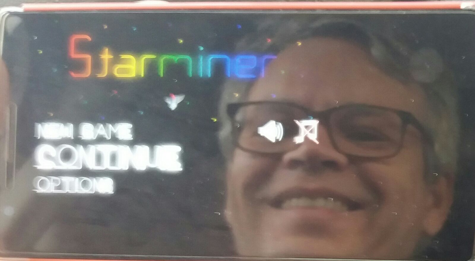 Edi Woodcock reflected on his phone's screen while running Starminer